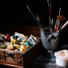 paint brushes in stainless steel bucket