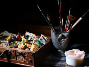paint brushes in stainless steel bucket